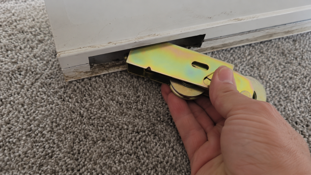 Re-hung sliding door tested after roller repair